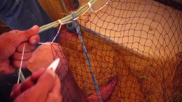 Fisherman Repairs Fishnet Fishing Lines — Stock Video