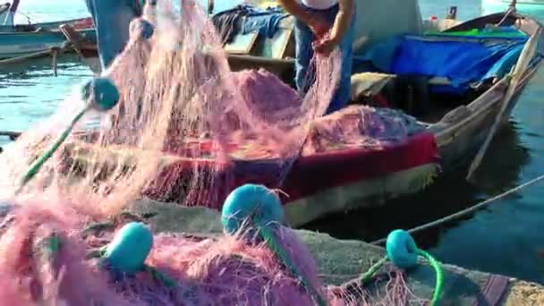 Fisherman Repairs Fishnet Fishing Lines — Stock Footage Fisherman Repairs Fishnet Fishing Lines Royalty Free Stock Video