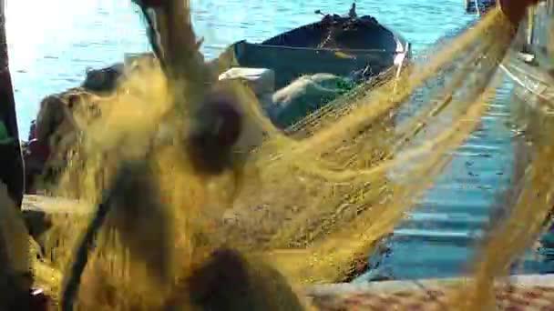 Fisherman Repairs Fishnet Fishing Lines — Stock Footage Fisherman Repairs Fishnet Fishing Lines Royalty Free Stock Footage
