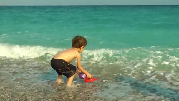 Young Boy Child having fun near the Beach — Stock Video