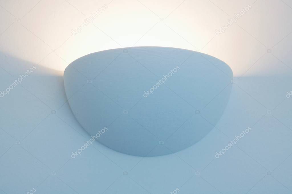 Semi-circular wall uplighter with glowing light beam