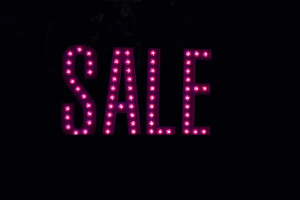 The word sale in pink dots on black background — Stock Photo, Image