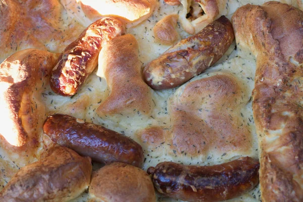A pile of food or toad-in-the hole savoury dish — Stock Photo, Image