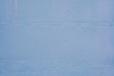 The background for the design is a dusty blue color