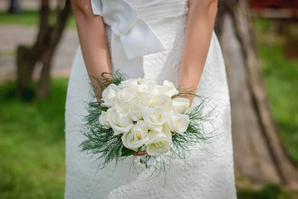 Delicate beautiful wedding bouquet of white roses and greenery i — Stock Photo, Image