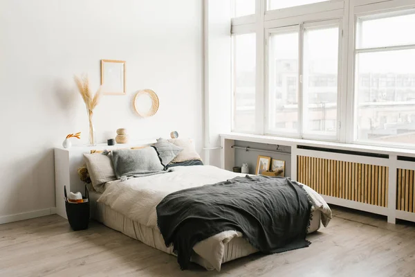 Bedroom interior in Scandinavian minimalist style in white and g