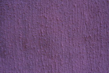 Mor alçı duvar. Fotokopi alanı olan macunun bozulmamış dokusu 