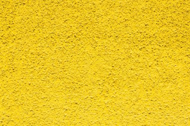 Sarı alçı duvar. Fotokopi alanı olan macunun bozulmamış dokusu 