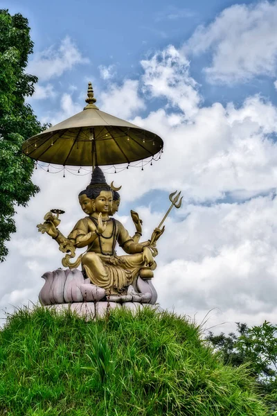 Brahma, the creator of all gods according to Hinduism. Umbrella