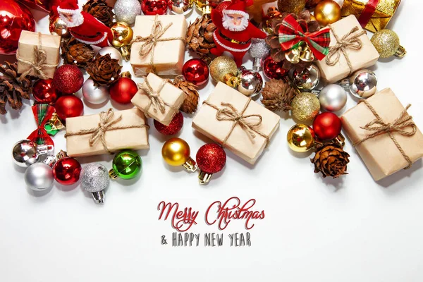 Merry Christmas and happy holidays xmas gifts. Baubles, presents, candy with christmas ornaments. Top view. Christmas family traditions on white background