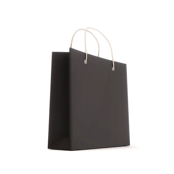 Pacote de compras o preto isolado em um fundo branco — Fotografia de Stock