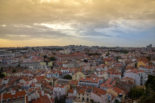 Lisbon panoramic view. Colorful walls of the buildings of Lisbon, with orange roofs , at sunset. Travel and real estate concept. Lisbon, Portugal. Europe — Stock Photo, Image