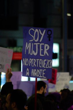 MADRID, SPAIN - MARCH 8, 2019: Massive feminist protest on 8M in favour of women's rights and equality in society. Protest posters could be seen during the demonstration, in Madrid, Spain on March 8, 