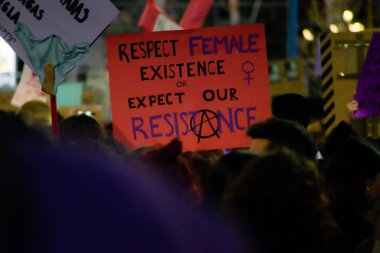 MADRID, SPAIN - MARCH 8, 2019: Massive feminist protest on 8M in favour of women's rights and equality in society. Protest posters could be seen during the demonstration, in Madrid, Spain on March 8, 
