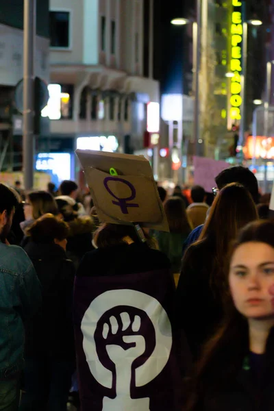 MADRID, SPAIN - MARCH 8, 2019: Massive feminist protest on 8M in favour of women's rights and equality in society. Protest posters could be seen during the demonstration, in Madrid, Spain on March 8, — Stok fotoğraf