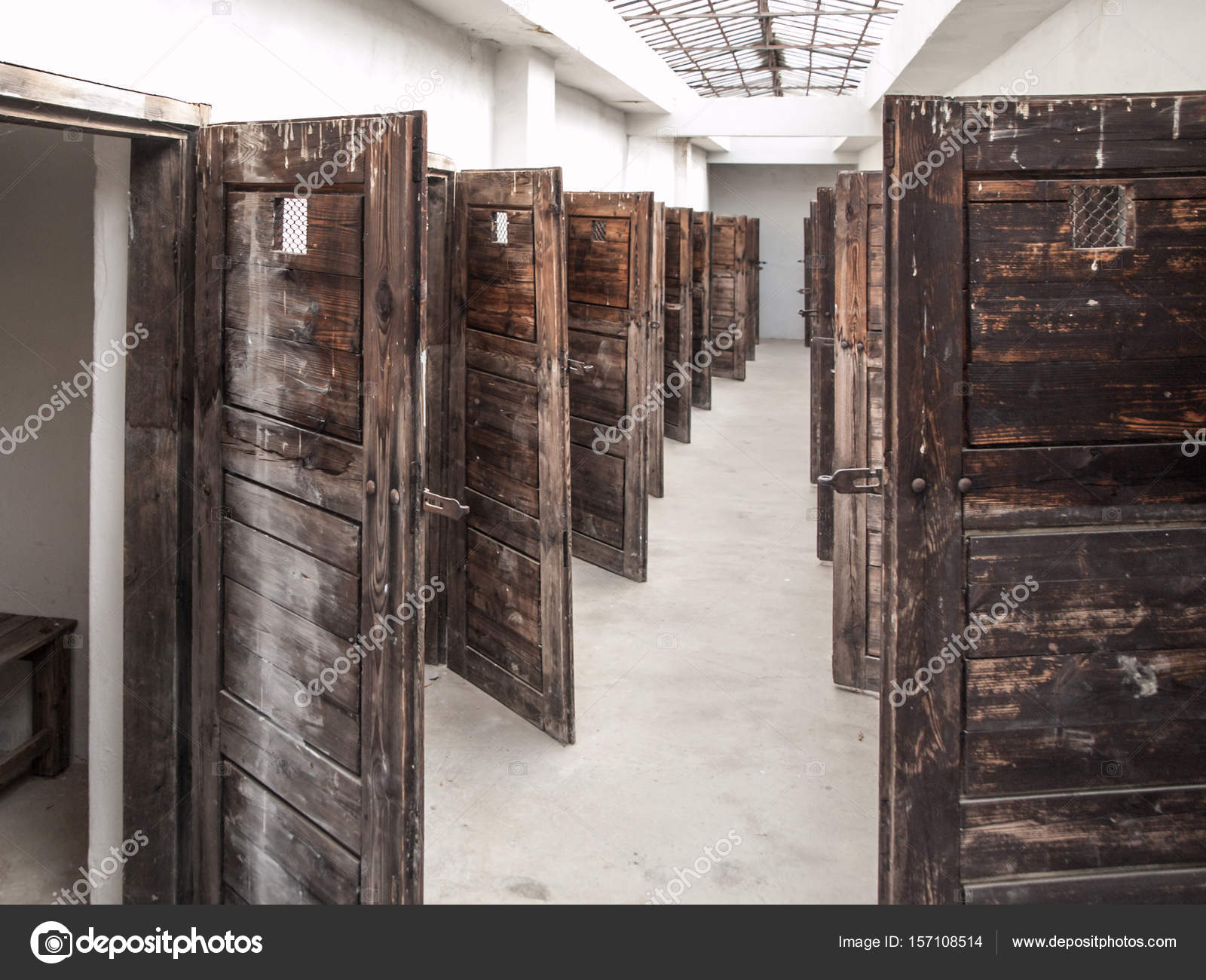 Long Corridor With Many Open Prison Cell Doors Vintage