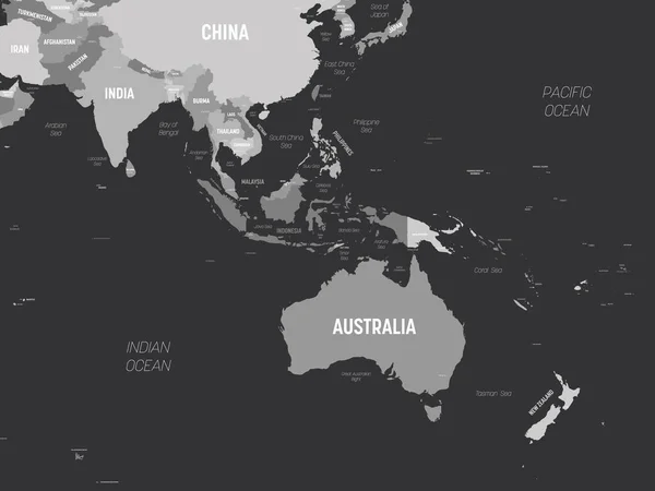 Карта Австралии и Юго-Восточной Азии - серый цвет на темном фоне. Высокая детальная политическая карта австралийского и юго-восточного регионов Азии с обозначением названий стран, столиц, океанов и морей — стоковый вектор