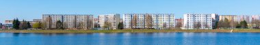 Housing estate at Mseno Reservoir. Blocks of flats at the water. Jablonec nad Nisou, Czech Republic clipart