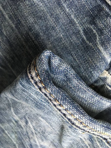 Abstract macro shot of retro jeans. Denim clothing. Minimalism.