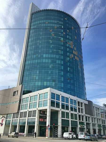 Glass skyscraper of green color. Architecture of the city of Donetsk.