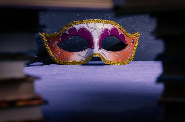 Venetian, carnival, theatrical face mask, with place for text on a dark background. Stealth, theater day, actor.