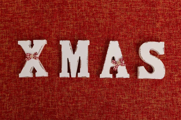 Christmas time banner template on red background. New Year decoration. Xmas white word. Flat-lay. New Year concept.