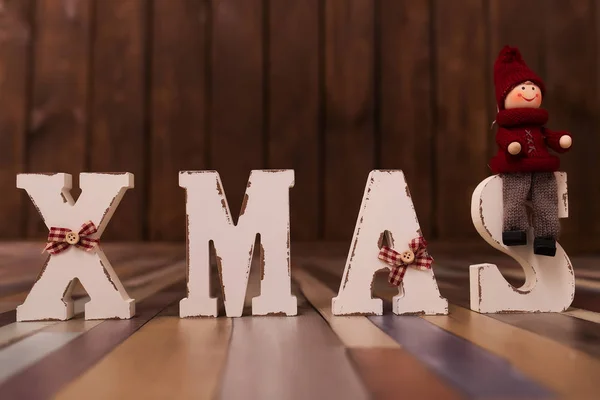 Christmas time banner template on wooden background. New Year decoration. Xmas white word. Flat-lay. New Year concept.