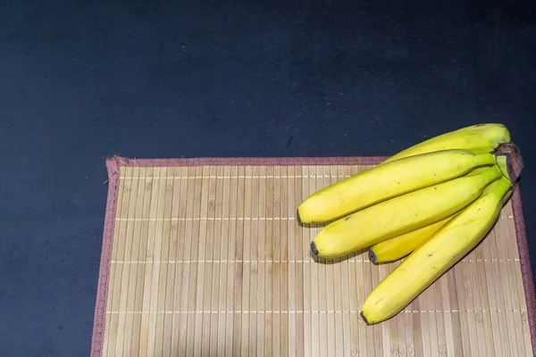 fresh banana branch on a serving board