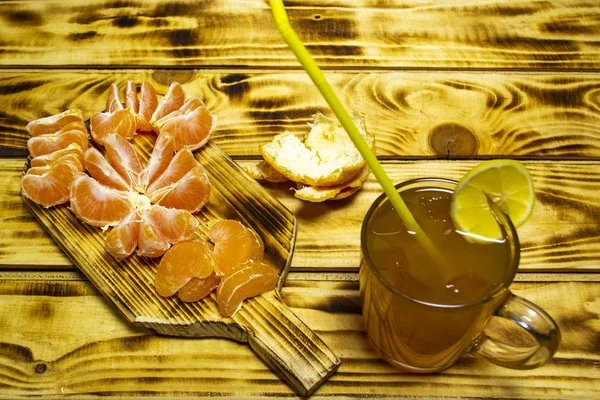 orange juice with slices of orange on the table, selective focus with shallow depth of field, warm filter