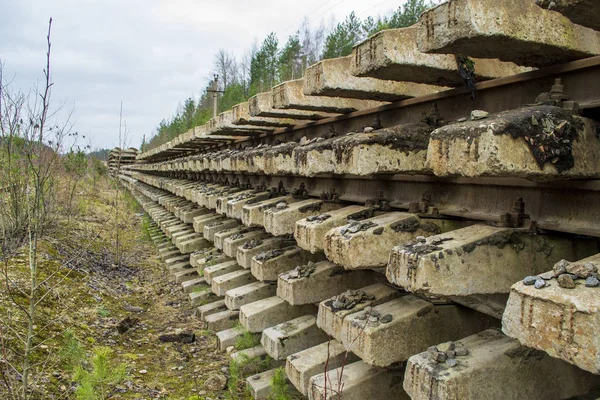 big pile of old abandoned rails and sleepers