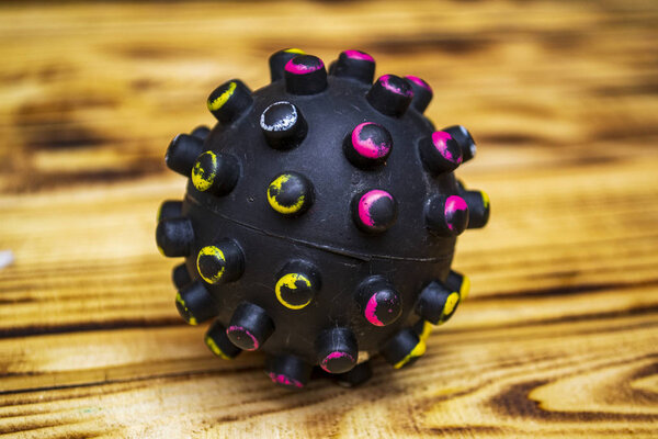 Coronavirus quarantine concept, on a wooden background, medical mask with capsule and virus