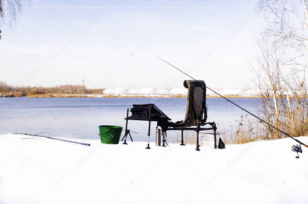 winter fishing, fishing chair near the lake