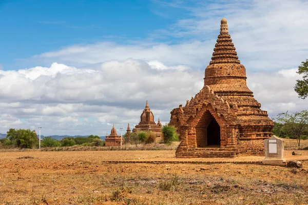 Buddhist pagoda temple. Bagan, Myanmar. Burma. Mandalay Region. Is home of the largest and denset concentration of religion Buddhist temples, pagodas, stupas and ruins in the world. Blue sky with few clouds.