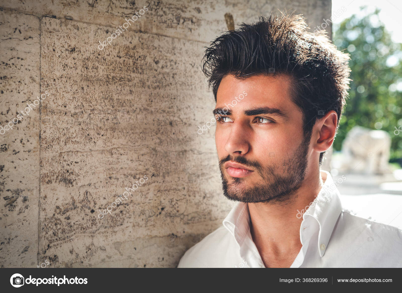 fashion male model posing outdoors in blue shirt and sunglasses Stock Photo  | Adobe Stock