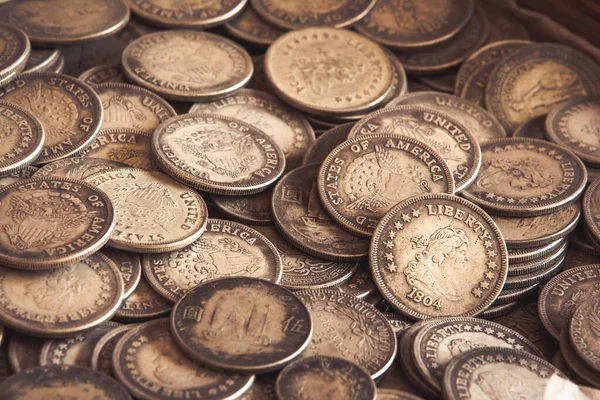 Ancient coins of the United States of America with liberty word mixed with some Chinese coins. Full background. Money from 1804.