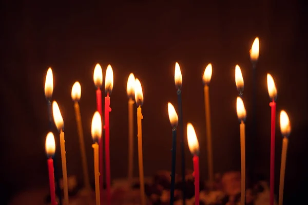 Multi-colored candles on the cake — Stockfoto
