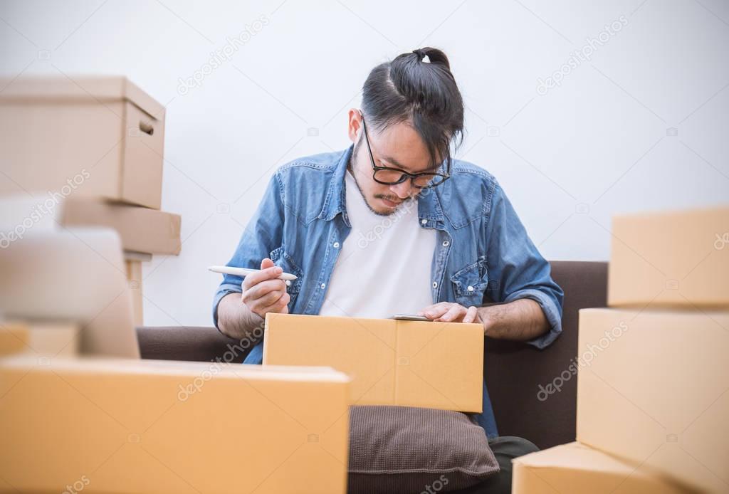 freelance man holding boxes working with boxes at home concept, delivery and shipping concept