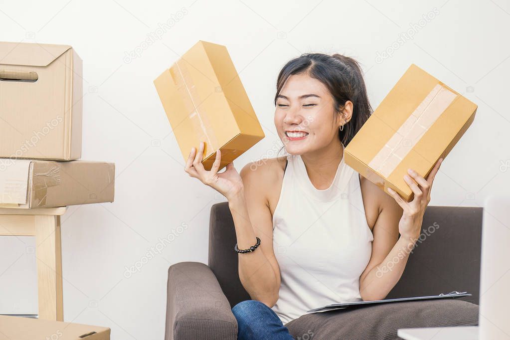 Woman working with boxes at home concept, delivery shipping concept