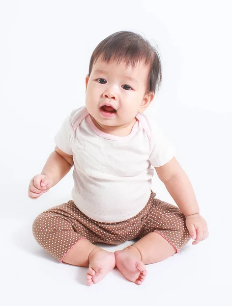 Cute Little Asian Babe Sitting Looking Camera Isolated White Background Royalty Free Stock Images