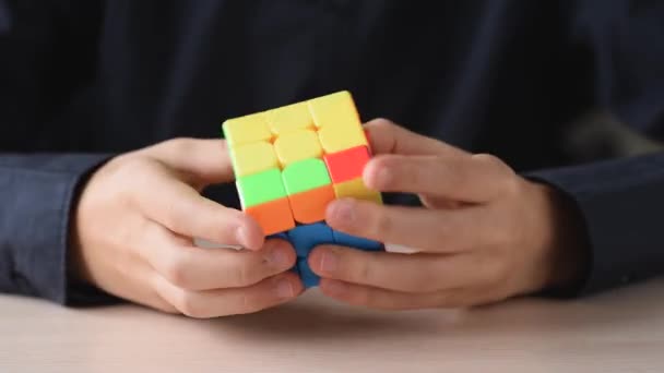 Dobrush Belarus November 2019 Boy Solves Puzzle Plays Rubik Cube — Stock Video