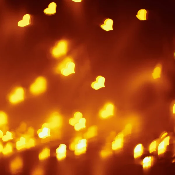 Αφηρημένο φόντο με ένα χρυσό θολή φώτα σε σχήμα καρδιάς. Ημέρα του Αγίου Βαλεντίνου έννοια — Φωτογραφία Αρχείου
