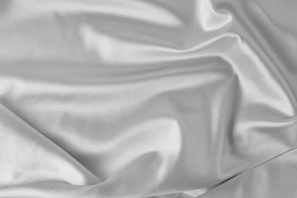 Gray silk background with a folds.  Abstract texture of rippled satin surface — 스톡 사진