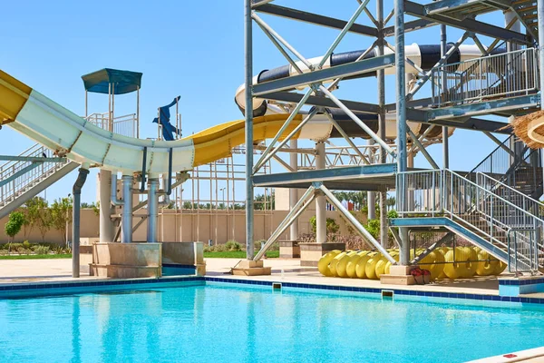 Close up of a tube water slide in aqua park against blue sky — Stock Photo, Image