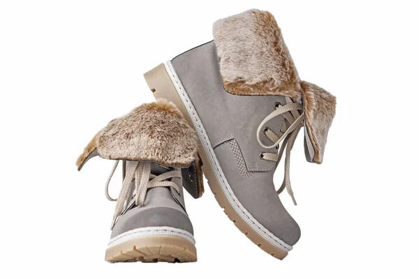 Par de botas de invierno para mujer sobre fondo blanco aisladas — Foto de Stock