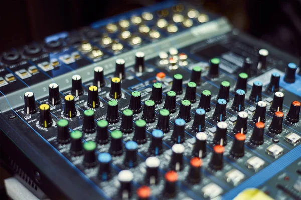 Audio music mixer console on a black background. Sound studio mixing desk — Stockfoto