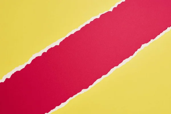 Torn ripped paper edge with a copy space, red and yellow color b