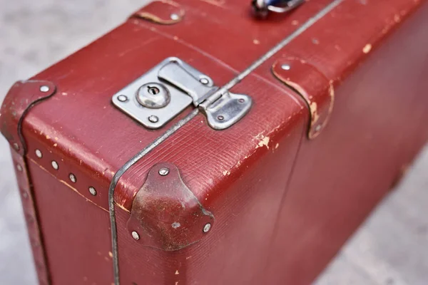 Part of vintage retro suitcase. Close up view of lock on old suit case