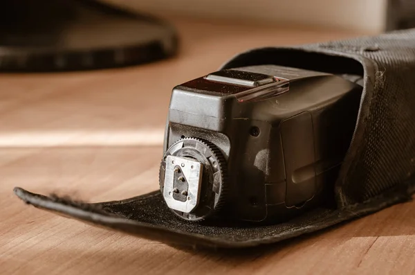 External flash for the camera in a protective case. — Stock Photo, Image