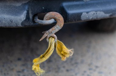 A tow rope with a hook broken during towing.