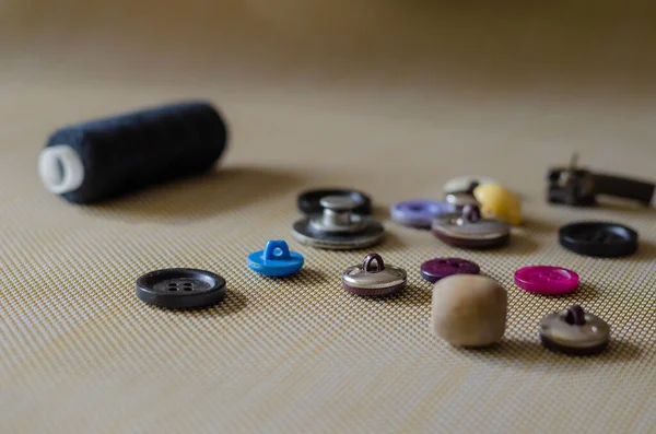 Various Buttons Table Spool Black Thread Used Buttons Textured Surface — Stock Photo, Image